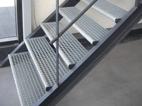 Grating treads on a steel stair